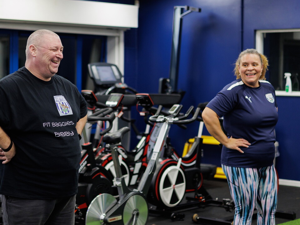 Smiling men and women after a workout