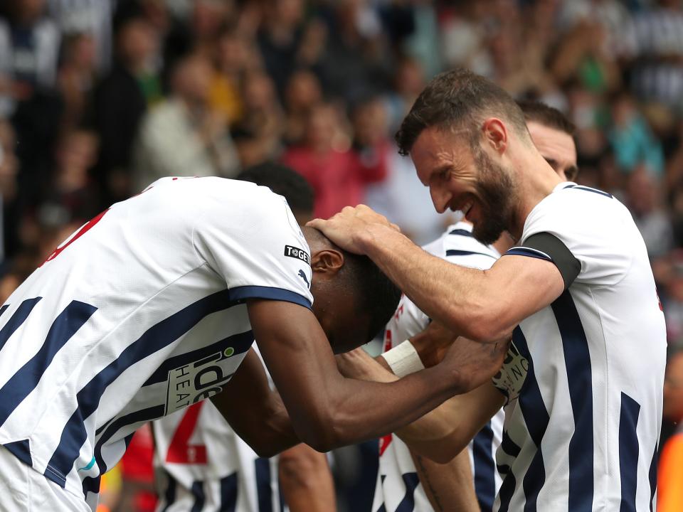 Erik Pieters helps Semi Ajayi celebrate his goal against Swansea 