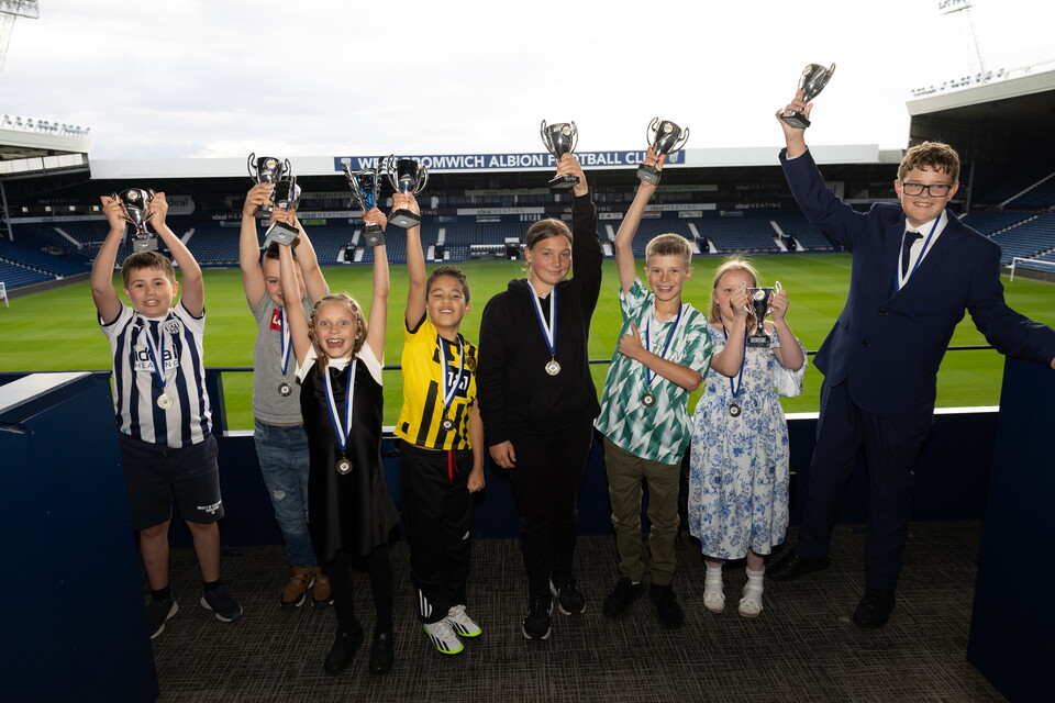 Participants celebrating at The Hawthorns with their trophies from the Disability Awards
