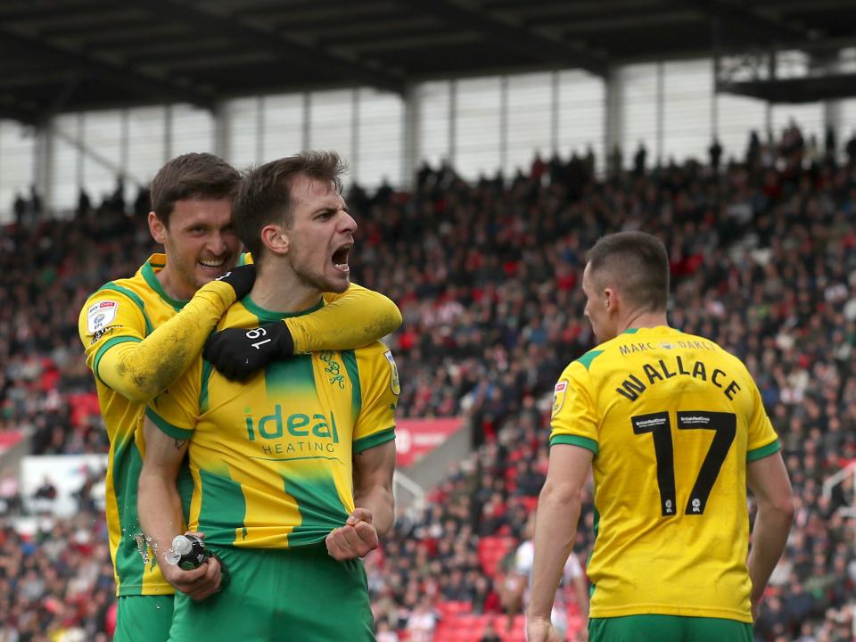 An image of Jayson Molumby celebrating one of his goals against Stoke