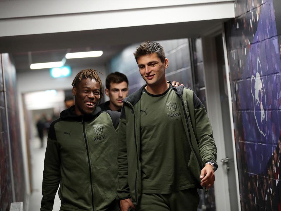 An image of Brandon Thomas-Asante and Okay Yokuslu arriving at Ashton Gate