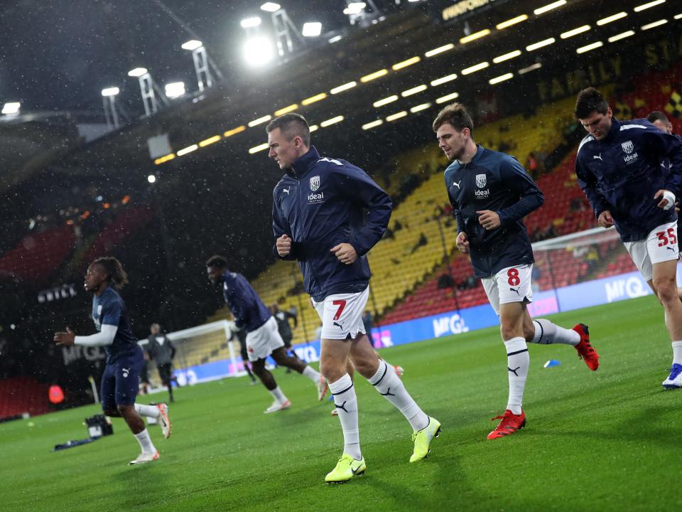 An image of Jed Wallace warming up before Albion play Watford