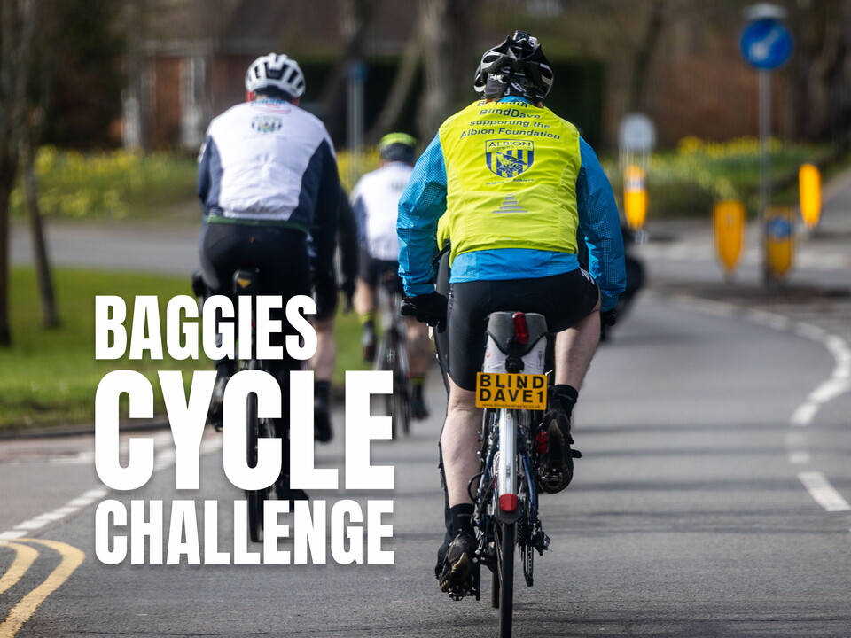 Behind cyclists riding down a road