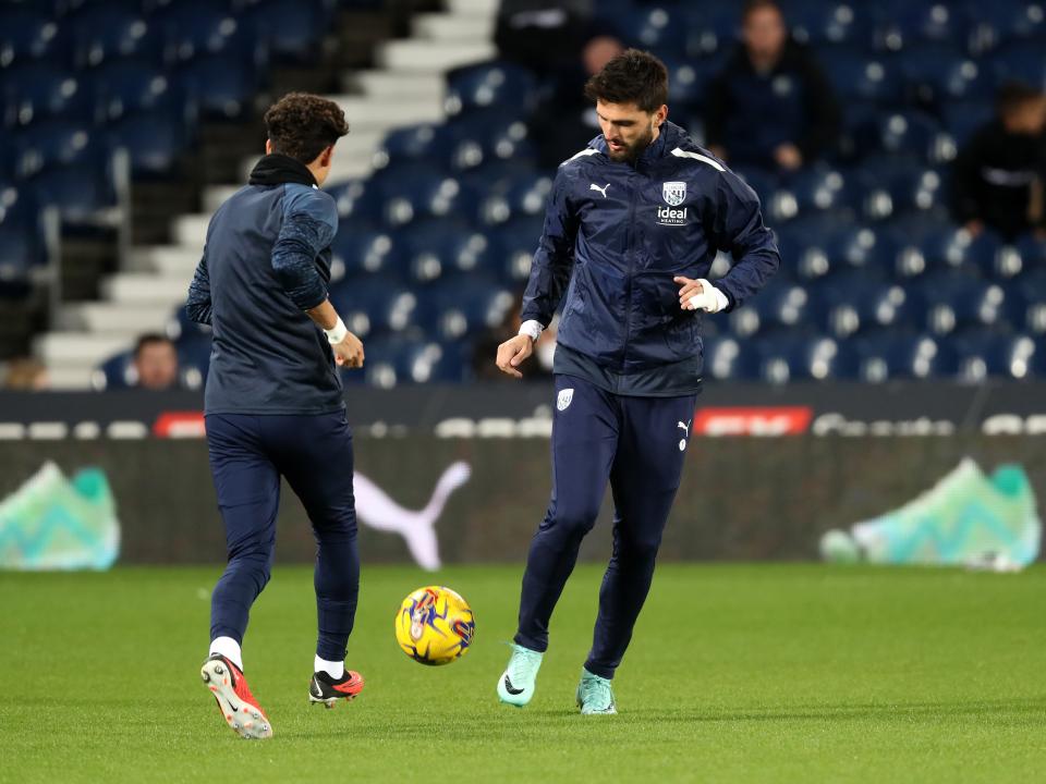 An image of Okay Yokuslu warming up against Ipswich