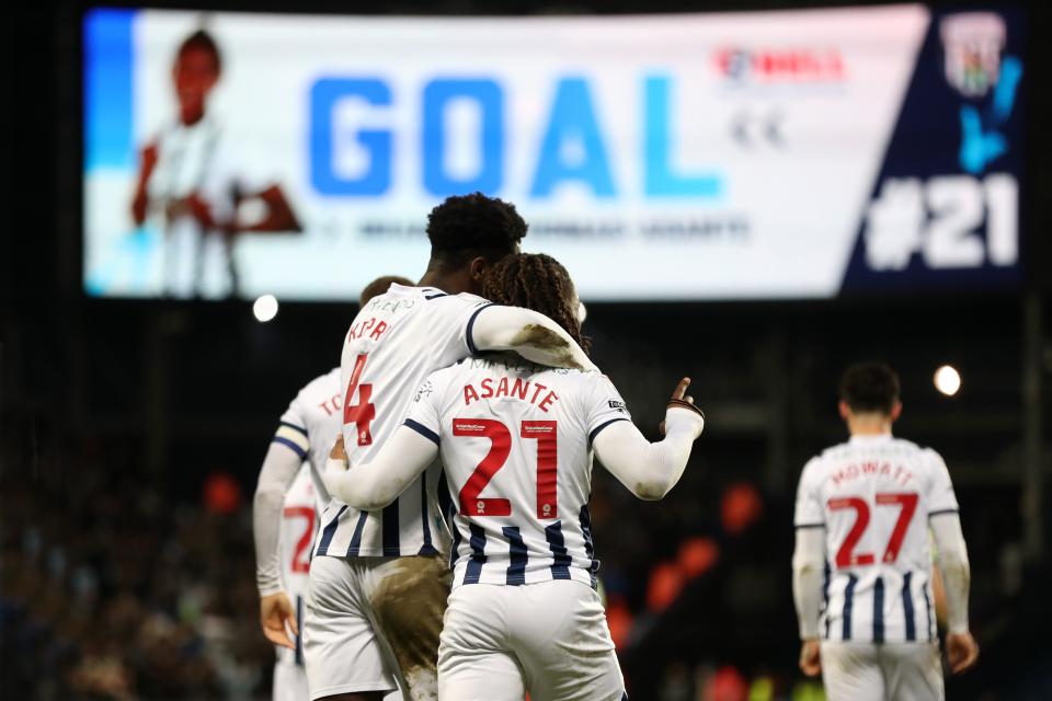 Brandon Thomas-Asante celebrates a goal against Blackburn with Cedric Kipre