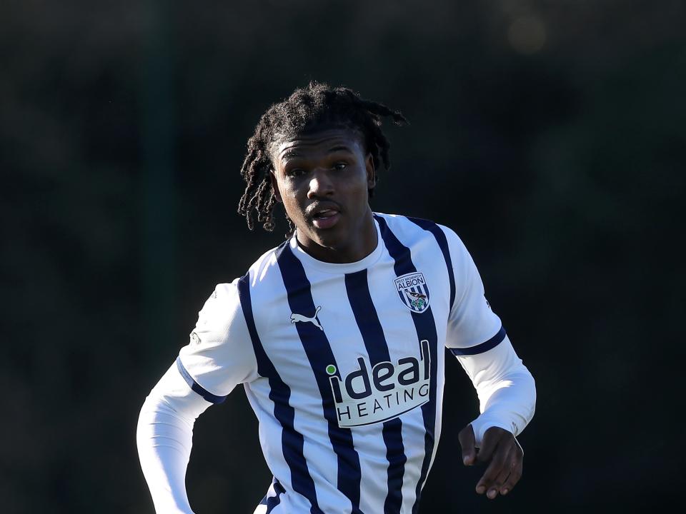 Aaron Harper-Bailey in action for the PL2 team wearing the home kit