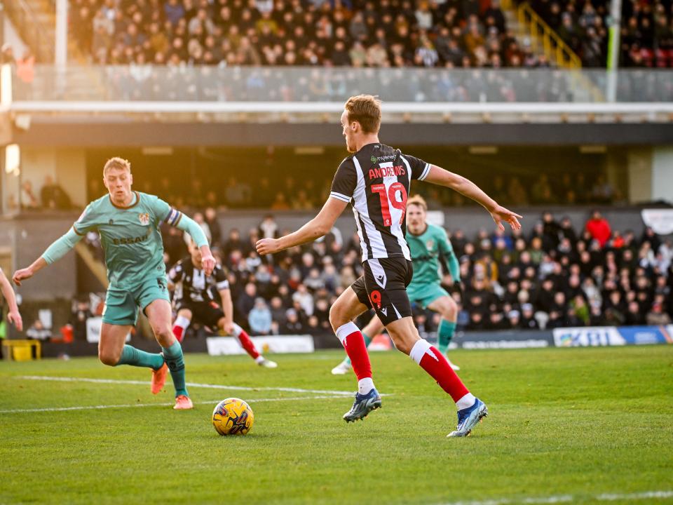 A photo of Albion midfielder Jamie Andrews in action for loan side Grimsby Town
