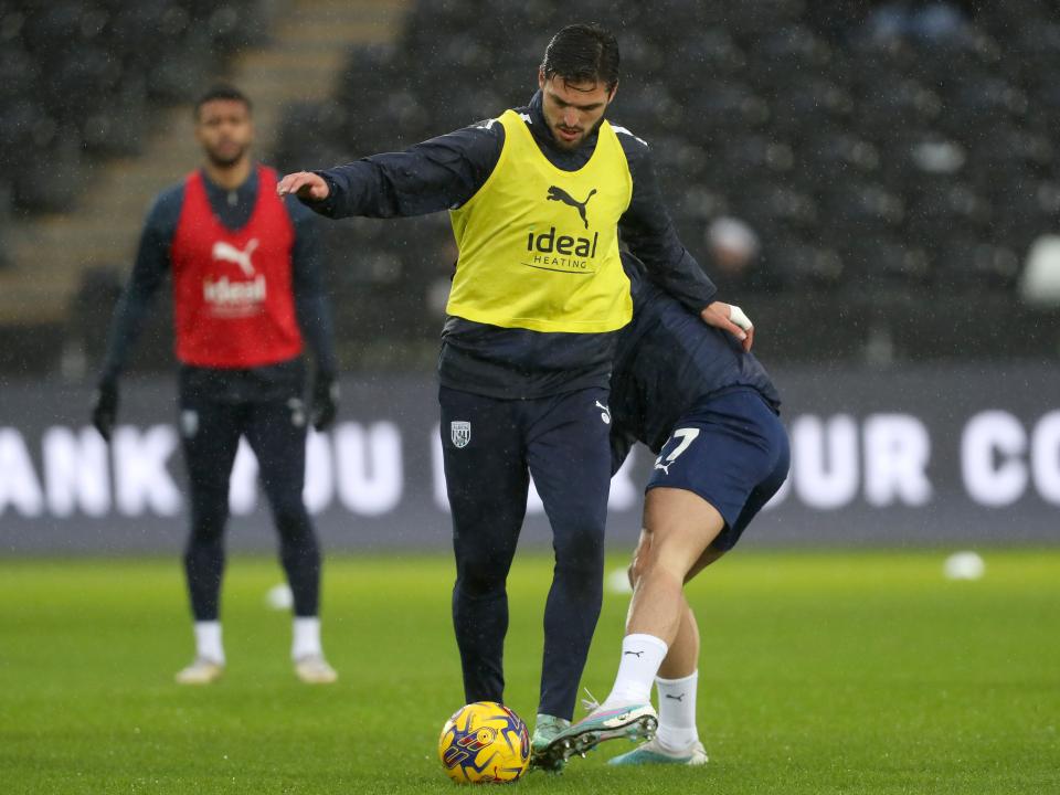 An image of Okay Yokuslu warming up against Swansea