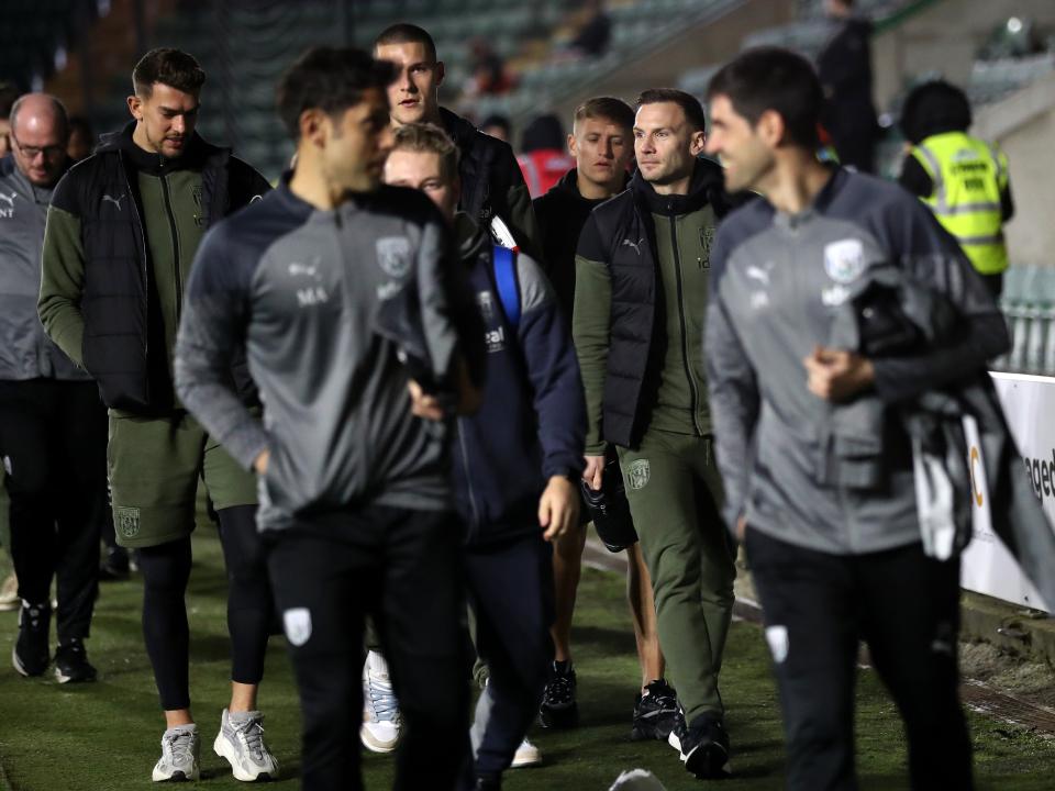 An image of Andi Weimann, Ted Cann, Alex Palmer and Callum Marshall arriving alongside staff at Plymouth's Home Park stadium
