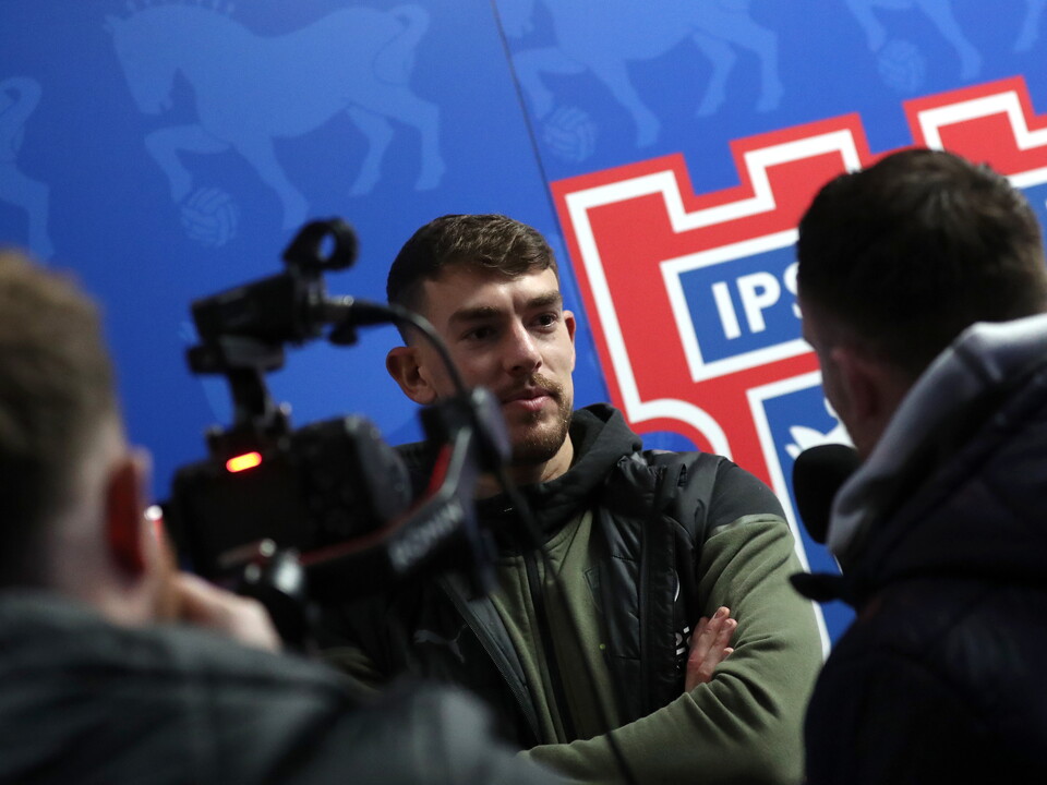 An image of Alex Palmer talking to WBA TV