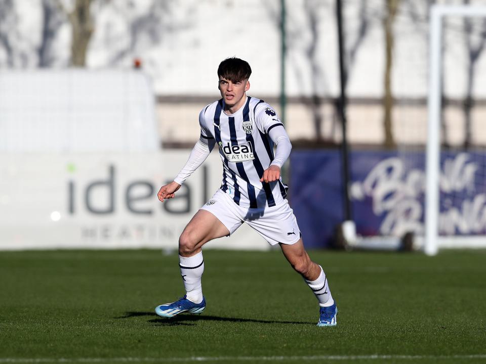 A photo of Alex Williams, in the 2023/24 home kit, playing in a PL2 game at the club's Walsall training ground