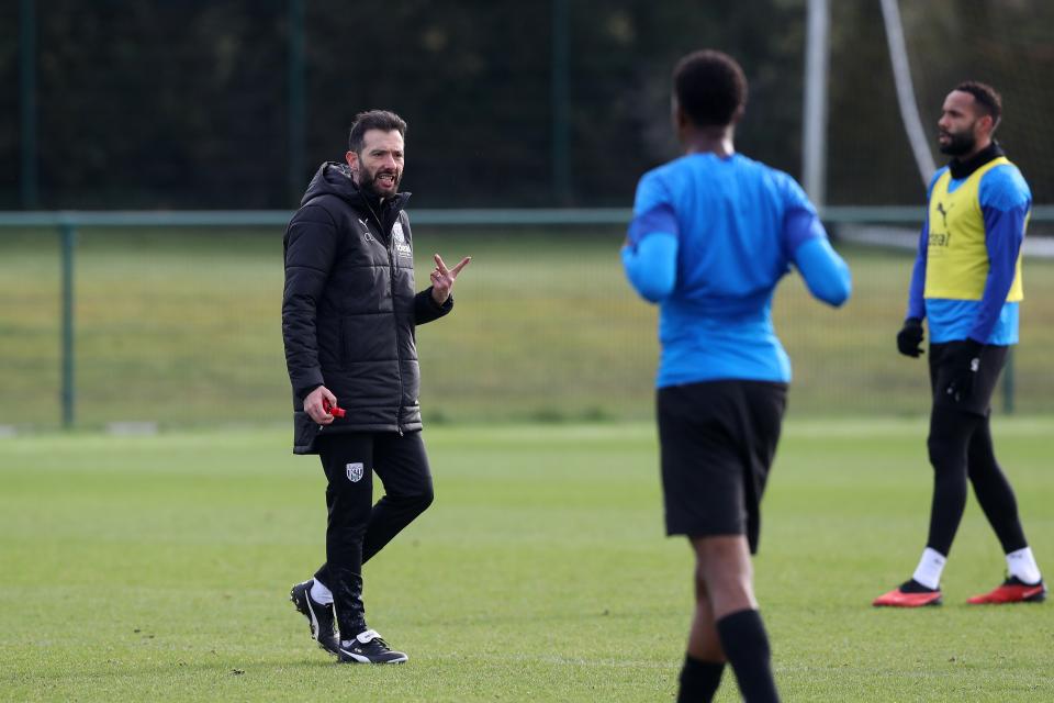 Carlos Corberán coaching his players on the training pitch