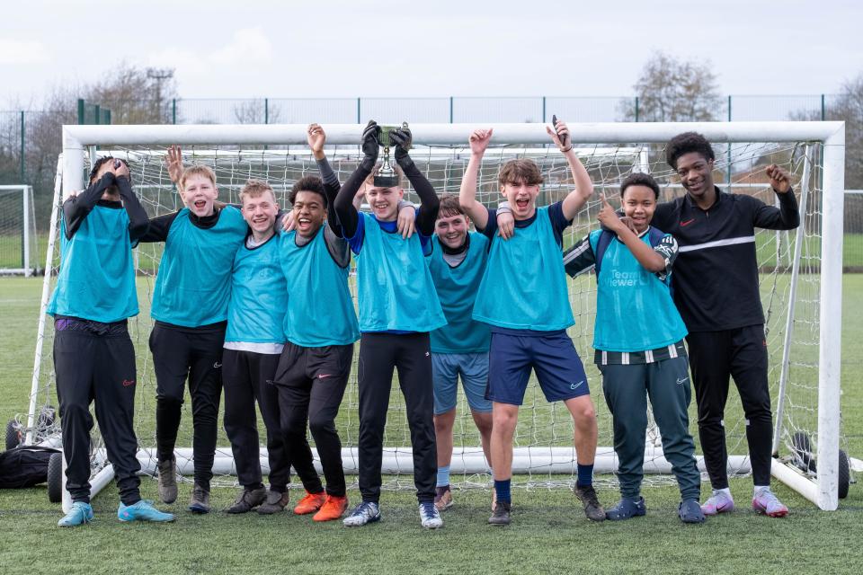 PL Kicks tournament winners celebrate with trophy