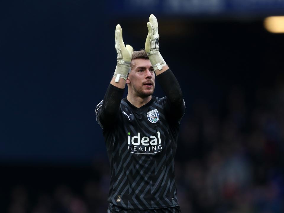 An image of Alex Palmer applauding the Albion supporters