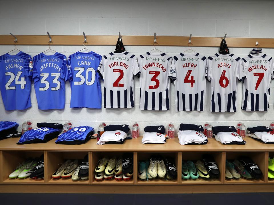 An image of blue and white Albion shirts hanging up in the Plymouth dressing room