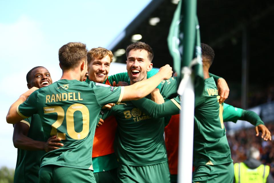 Plymouth players celebrating a goal scored at Home Park