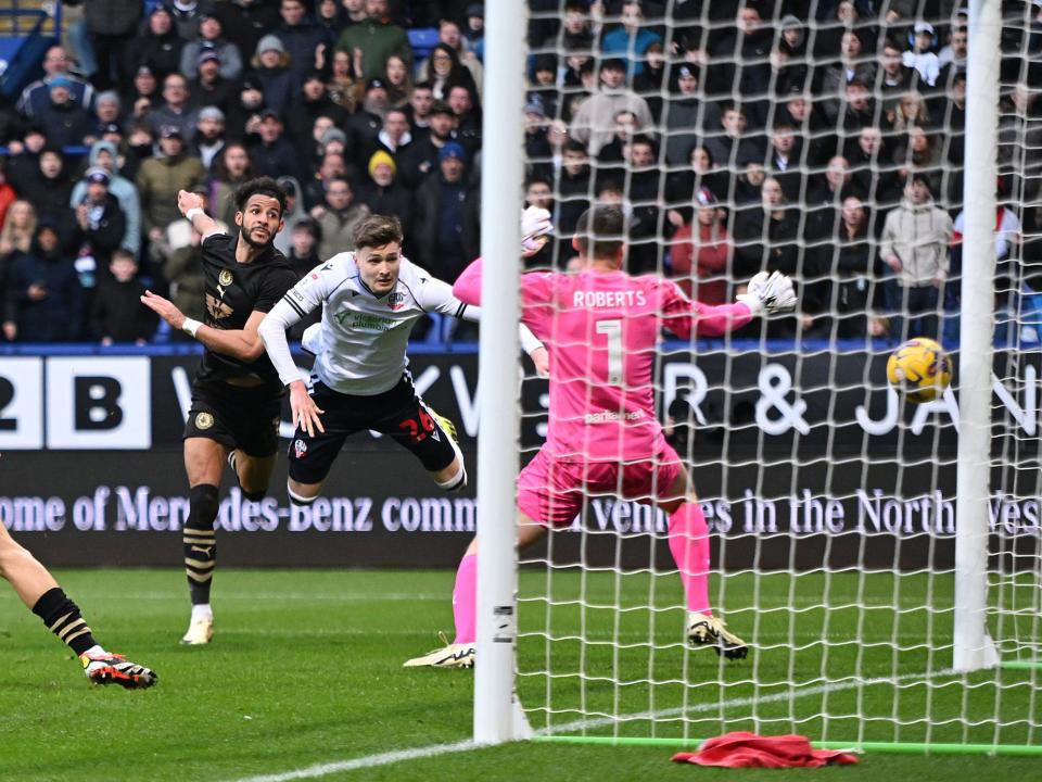 Zac Ashworth scoring a header against Barnsley for Bolton
