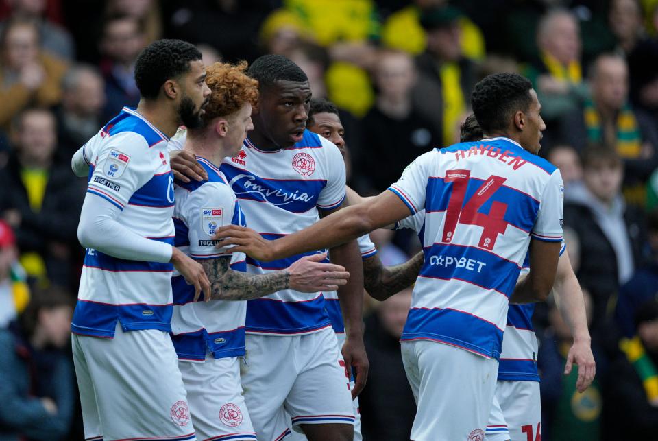 QPR players celebrate scoring a goal against Norwich City