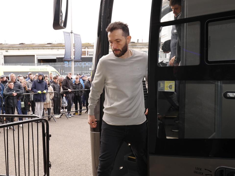 An image of Carlos Corberán getting off the bus at Millwall