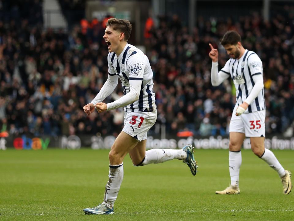 An image of Tom Fellows celebrating a goal