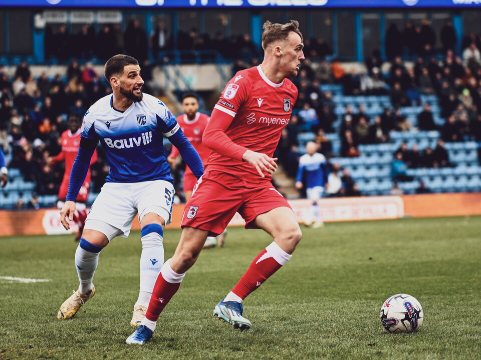 A photo of Albion youngster Jamie Andrews in action for loan club Grimsby in their red away strip