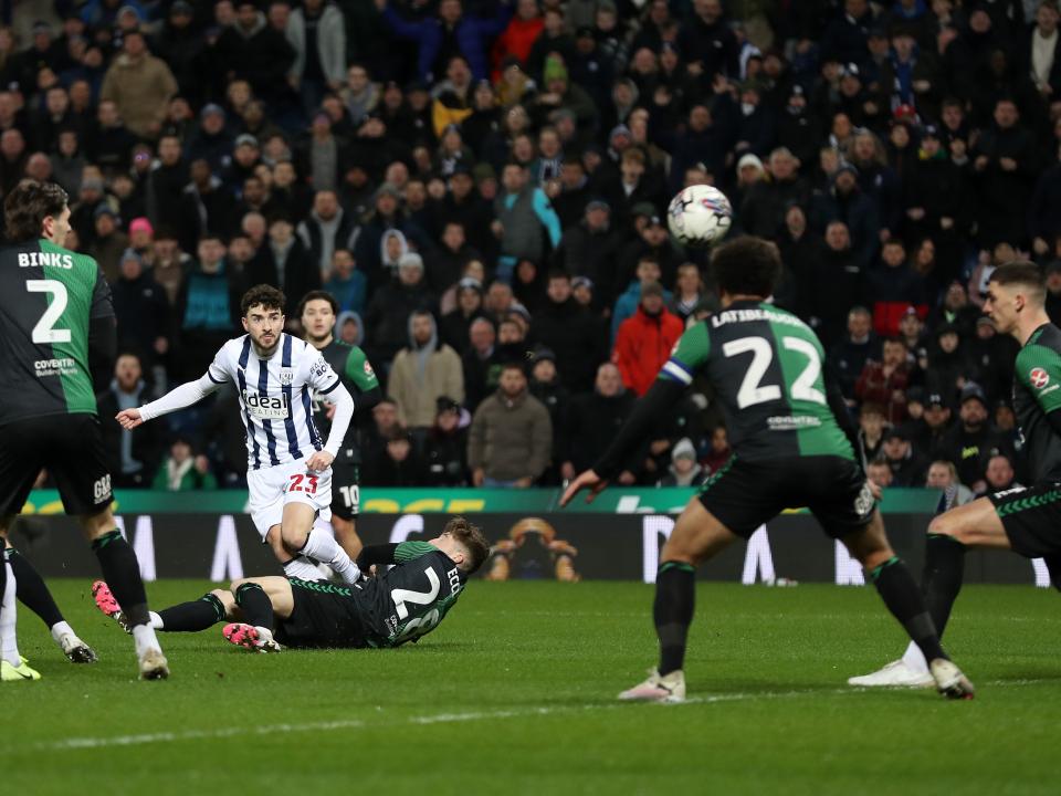 An image of Mikey Johnston scoring against Coventry