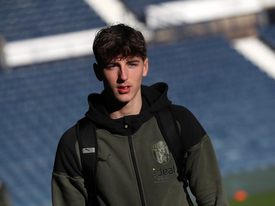 A photo of Albion youngster Josh Shaw arriving at The Hawthorns in green tracksuit wear