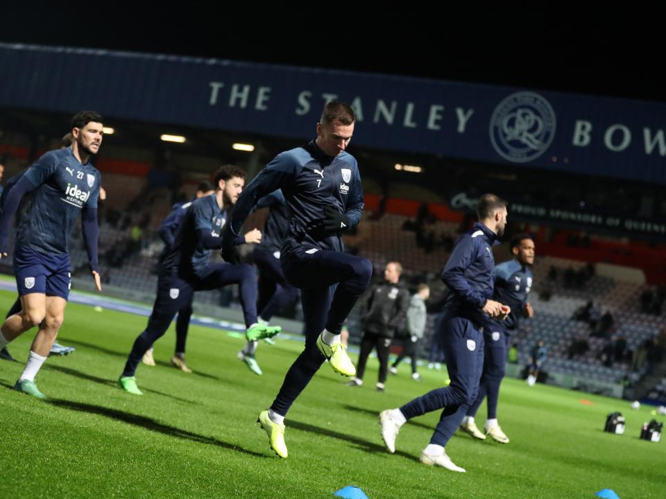 An image of Jed Wallace warming up before Albion's game against QPR