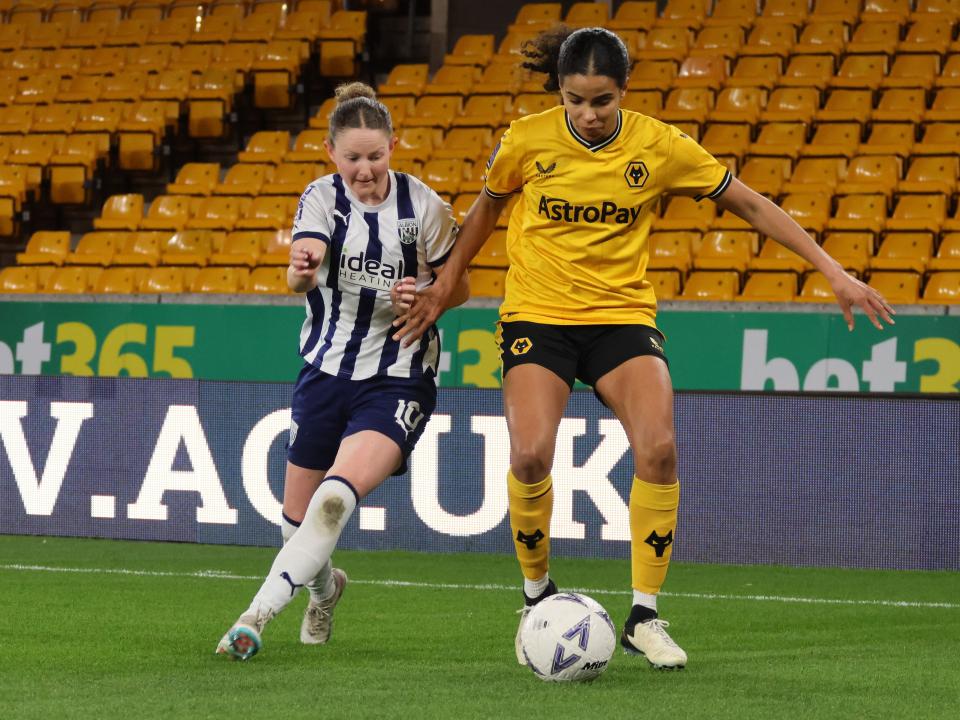An image of Olivia Rabjohn battling for possession at Wolves
