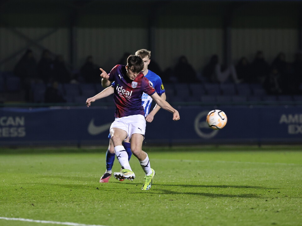 A photo of Alex Williams in the 23/24 away kit in action v Brighton in Premier League 2