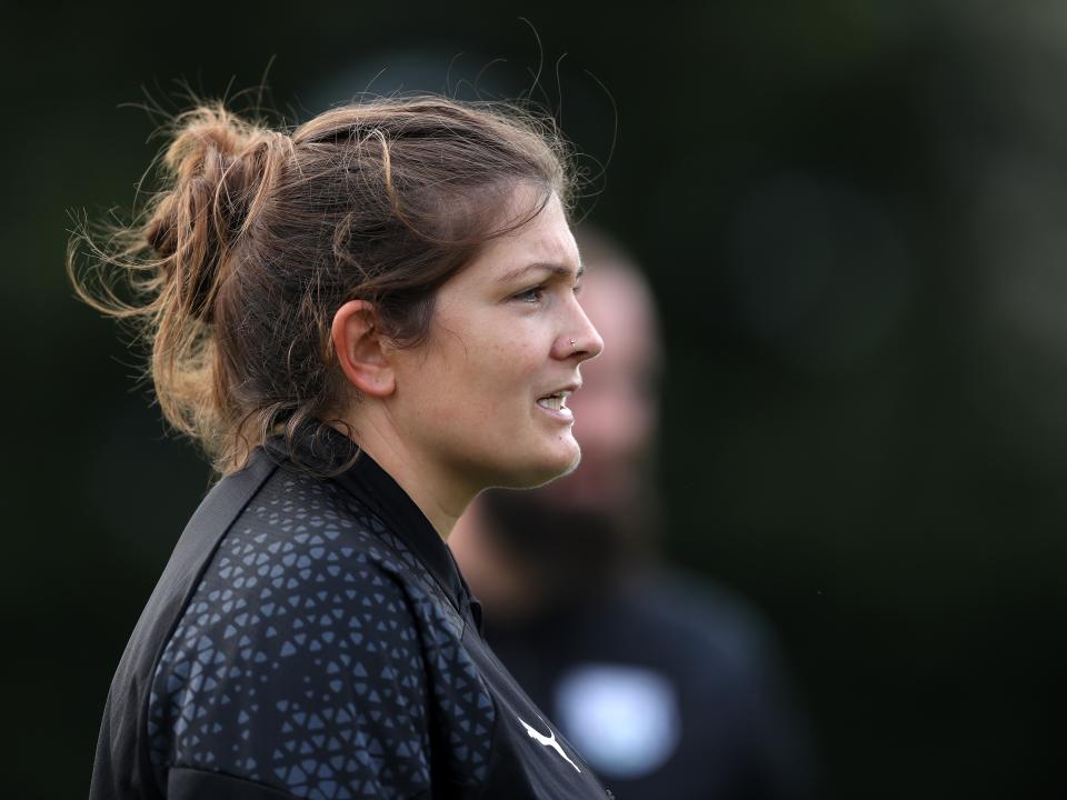 Siobhan Hodgetts-Still on the side of the pitch 