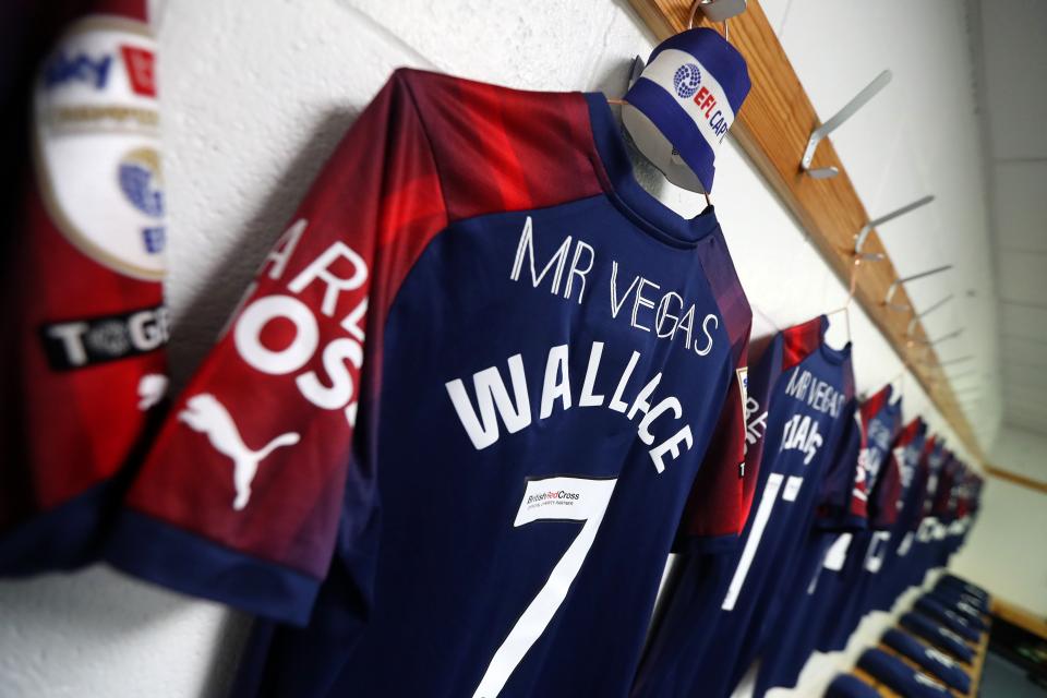 An image of Jed Wallace's shirt hanging in the dressing room at Huddersfield