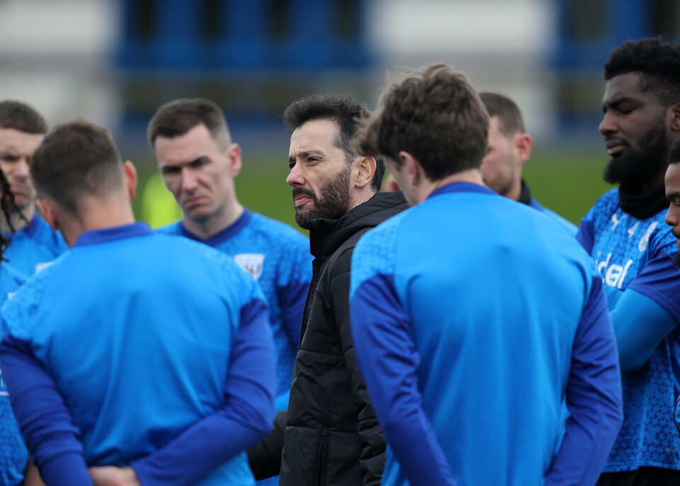 Albion players alongside Carlos Corberán.