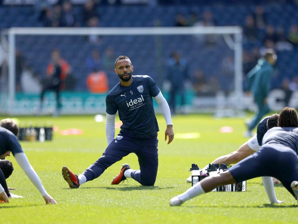 An image of Kyle Bartley stretching ahead of Albion's game against Watford