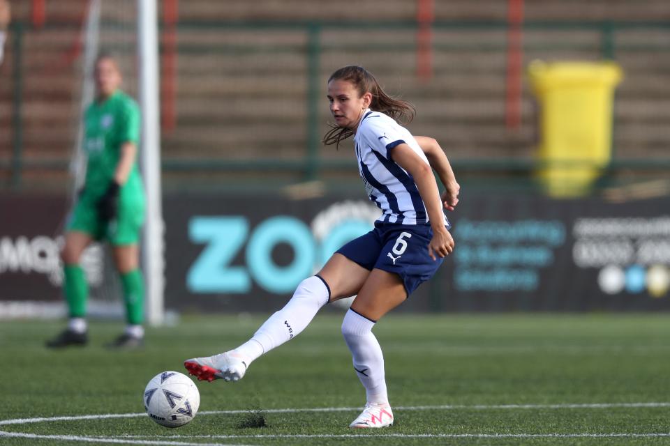 Izzy Green in action for WBA Women in the home kit