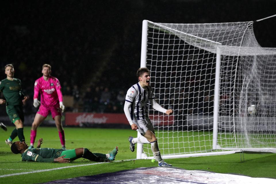 Tom Fellows celebrates scoring against Plymouth wearing the home kit 