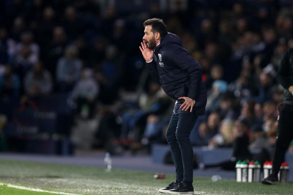 Carlos Corberán shouting to his players on the side of the pitch at The Hawthorns