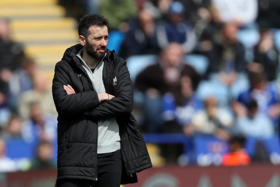 Carlos Corberán watching an Albion game with his arms folded 