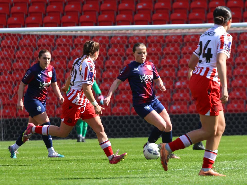 An image of Abi Loydon on the ball against Stoke