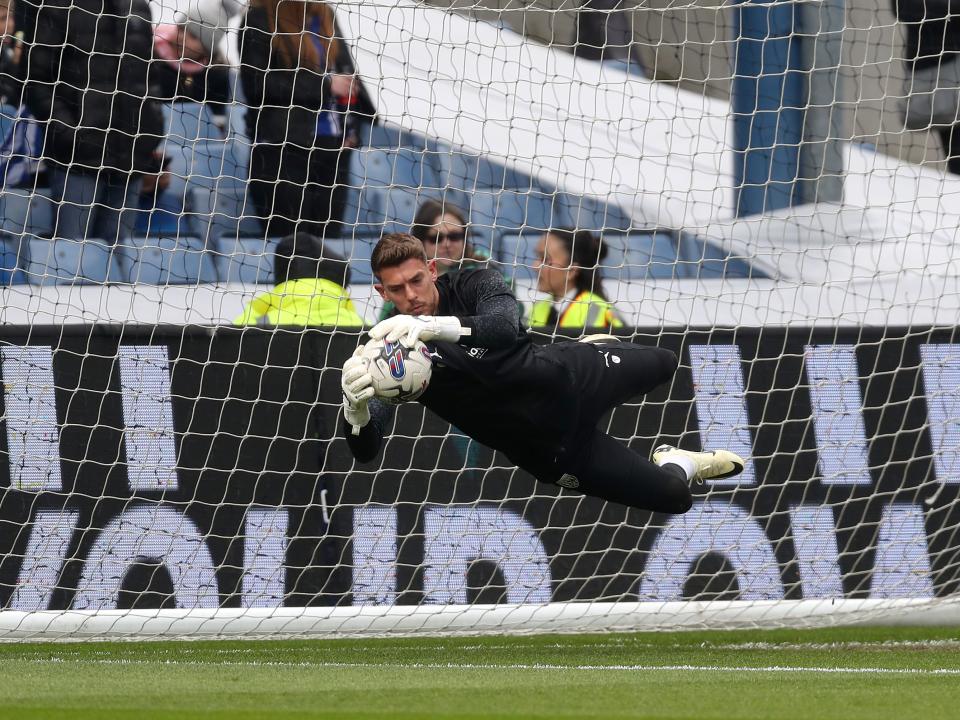 An image of Alex Palmer making a save in the warm up at Hillsborough