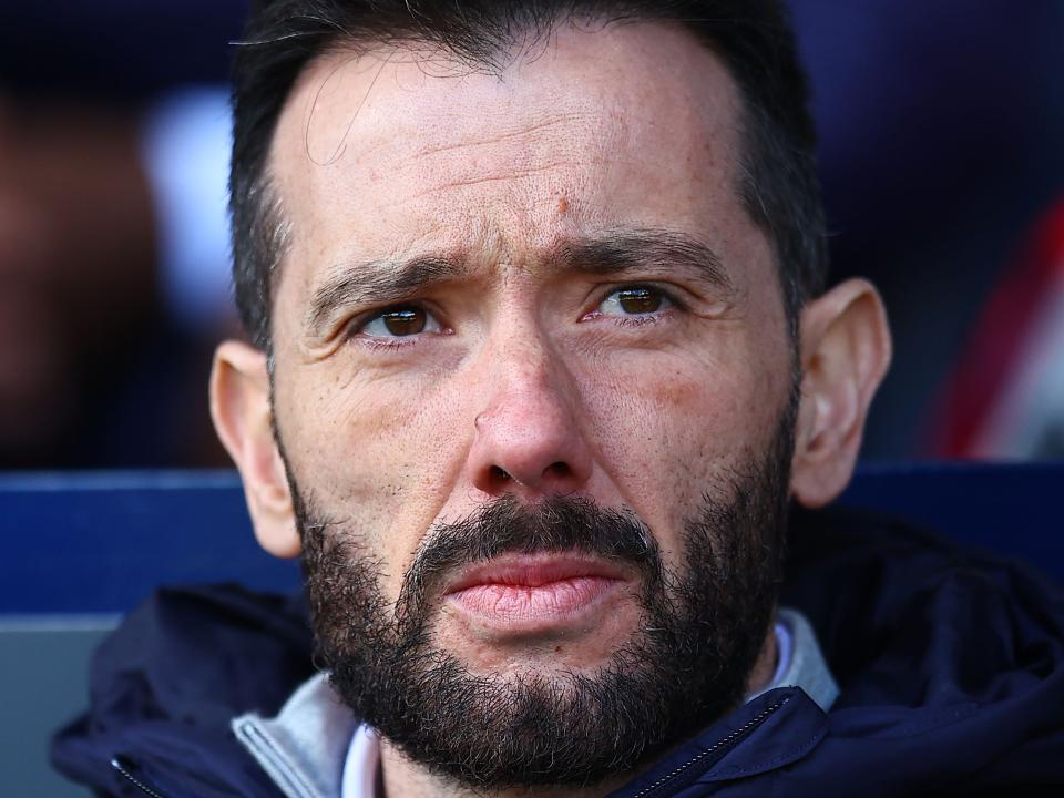 A close up of Carlos Corberán's face