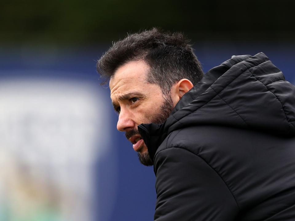 Carlos Corberán watching training 