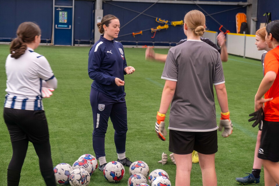 Anna Miller gives instructions to a group of budding young goalkeepers during The Albion Foundation's Whitsun half-term goalkeeper camp.