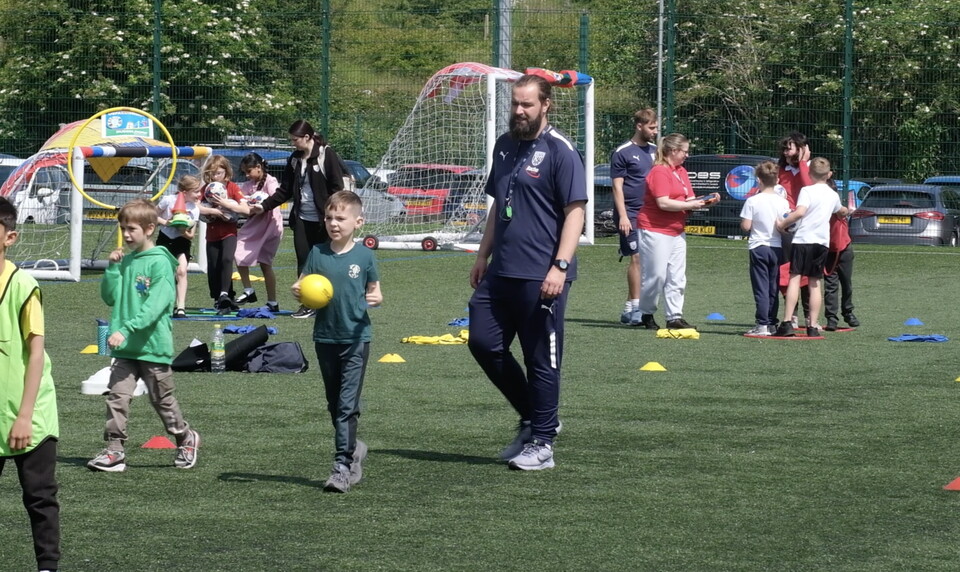 Rob Elliott oversees SEND Festival participants throwing dodgeballs.