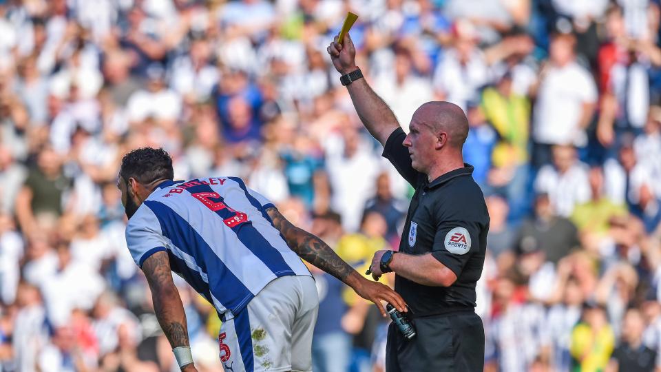 Kyle Bartley is booked while playing for Albion against Stoke in September 2018