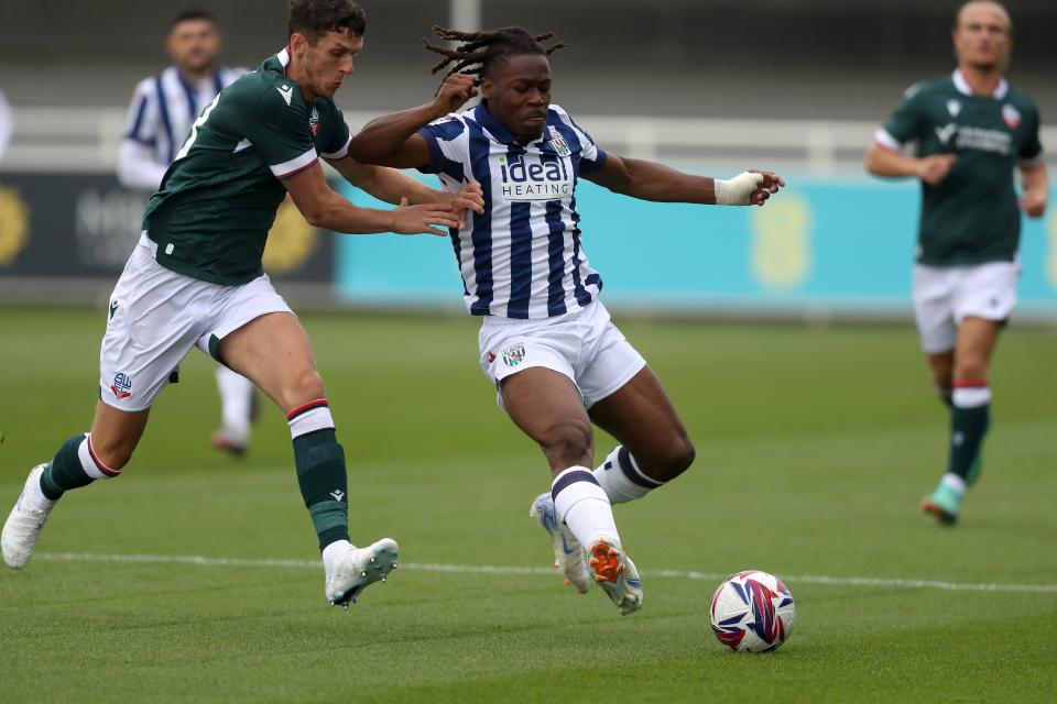 Brandon Thomas-Asante fighting to get the ball during a pre-season fixture against Bolton Wanderers at St George's Park
