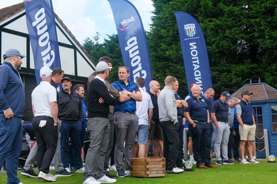 The Albion Foundation's golfers talk amongst themselves in-front of Sandwell Park Golf Club.  