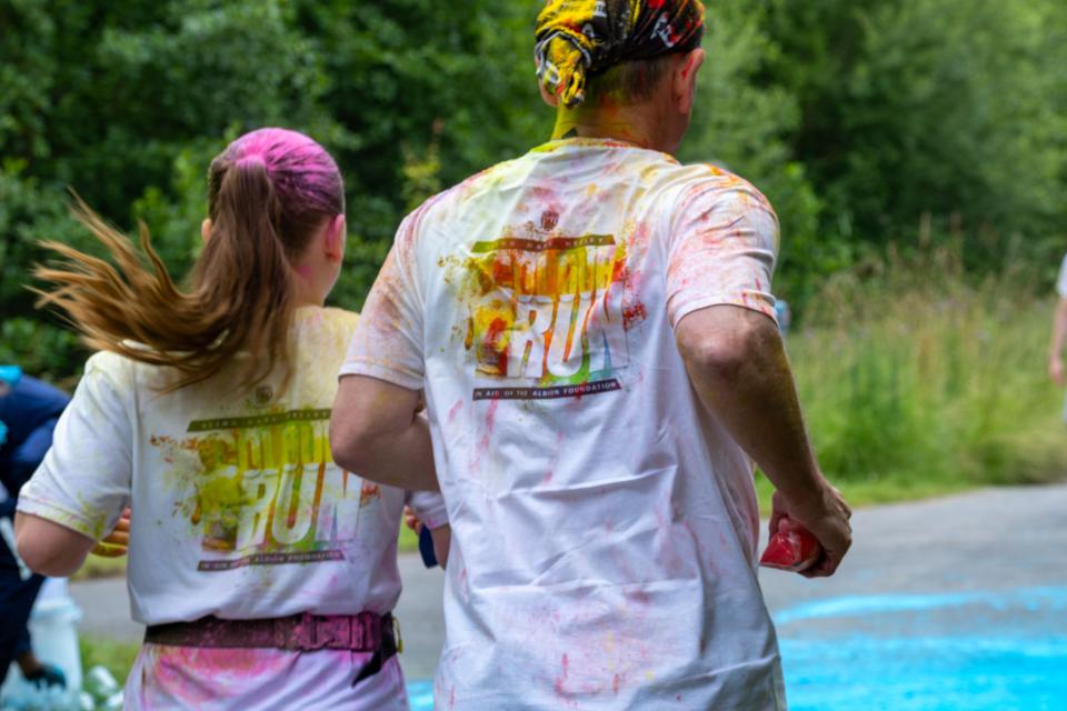 Back of Blind Dave Heeley and Dannie Heeley running the course. 