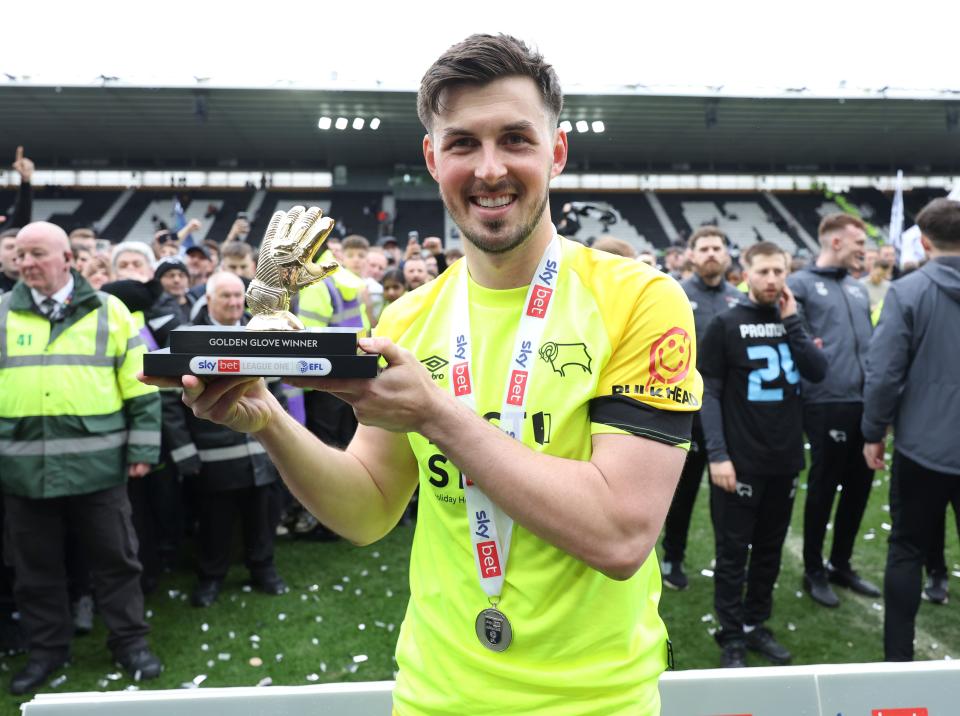 A photo of Joe Wildsmith with the League One Golden Glove Award for then club Derby County