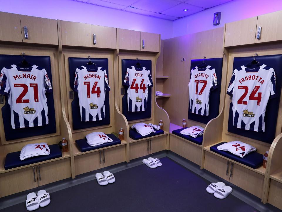 An image of home shirts hanging up in the dressing room